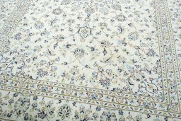 Close-up detail of New Kashan rug from Iran / Persia showing Wool weave