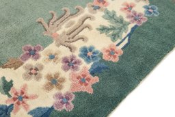 Backside of handmade 1940s China rug showing knot structure and weave density
