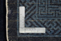 Close-up detail of 1990s China rug from Iran / Persia showing Wool weave