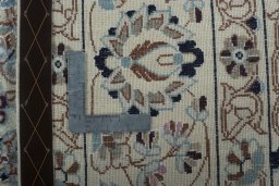 Backside of handmade New Nain rug showing knot structure and weave density