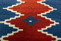 Backside of handmade New Modern Design rug showing knot structure and weave density