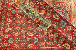 Corner detail of 1920s Bijar rug showing border pattern and Wool pile