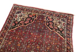 Surface texture of 1920s Bijar rug with natural Wool and intricate pattern