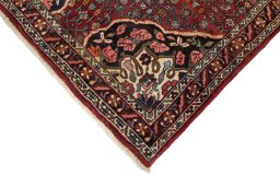 Backside of handmade 1920s Bijar rug showing knot structure and weave density