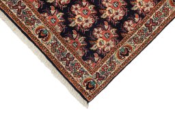 Backside of handmade New Bijar rug showing knot structure and weave density