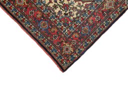 Backside of handmade 1920s Bijar rug showing knot structure and weave density