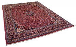 Corner detail of 2000s Bijar rug showing border pattern and Wool pile