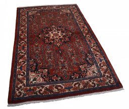 Corner detail of 2000s Bijar rug showing border pattern and Wool pile