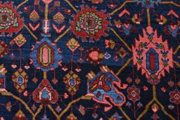 Backside of handmade 1930s Bijar rug showing knot structure and weave density