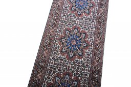 Backside of handmade New Bijar rug showing knot structure and weave density