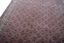 Backside of handmade New Bijar rug showing knot structure and weave density