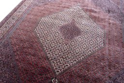 Backside of handmade New Bijar rug showing knot structure and weave density