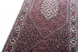 Backside of handmade New Bijar rug showing knot structure and weave density