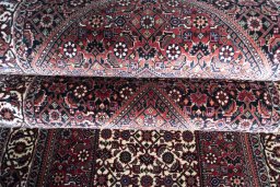 Full view of New Bijar rug from Iran / Persia, 405 × 76 cm in Red tones