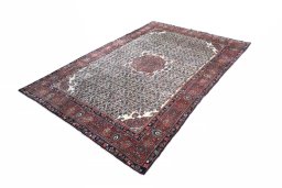 Corner detail of 1970s Bijar rug showing border pattern and Wool pile