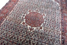 Backside of handmade 1970s Bijar rug showing knot structure and weave density