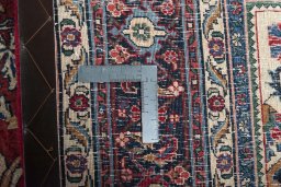Backside of handmade 1970s Bijar rug showing knot structure and weave density