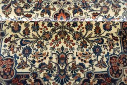 Corner detail of 2000s Bijar rug showing border pattern and Wool pile