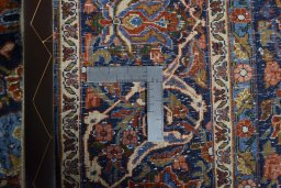 Backside of handmade 1970s Bijar rug showing knot structure and weave density