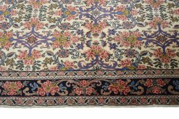 Corner detail of 2000s Bijar rug showing border pattern and Wool pile