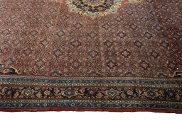 Corner detail of 1970s Bijar rug showing border pattern and Cork pile
