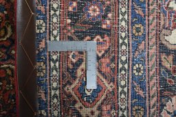 Backside of handmade 1970s Bijar rug showing knot structure and weave density