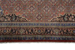 Full view of 1970s Bijar rug from Iran / Persia, 403 × 275 cm in Red tones