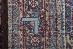 Backside of handmade 1970s Bijar rug showing knot structure and weave density