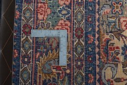 Backside of handmade 1970s Bijar rug showing knot structure and weave density