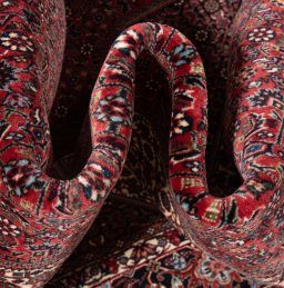 Backside of handmade New Bijar rug showing knot structure and weave density