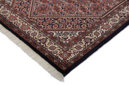 Backside of handmade New Bijar rug showing knot structure and weave density