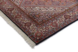 Backside of handmade New Bijar rug showing knot structure and weave density
