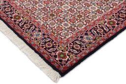 Backside of handmade New Bijar rug showing knot structure and weave density