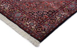 Backside of handmade New Bijar rug showing knot structure and weave density
