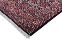 Backside of handmade New Bijar rug showing knot structure and weave density