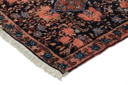 Backside of handmade 1920s Bijar rug showing knot structure and weave density