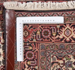 Corner detail of New Bijar rug showing border pattern and Wool pile