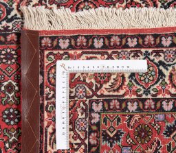 Backside of handmade New Bijar rug showing knot structure and weave density