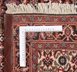 Backside of handmade New Bijar rug showing knot structure and weave density