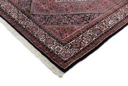 Backside of handmade New Bijar rug showing knot structure and weave density