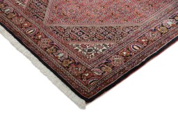 Backside of handmade New Bijar rug showing knot structure and weave density