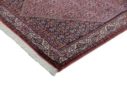 Backside of handmade New Bijar rug showing knot structure and weave density