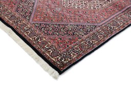 Backside of handmade New Bijar rug showing knot structure and weave density