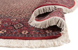 Backside of handmade New Bijar rug showing knot structure and weave density