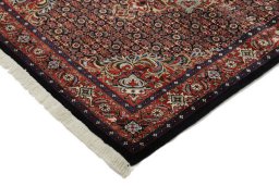 Backside of handmade New Bijar rug showing knot structure and weave density