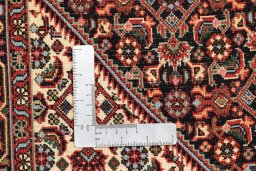 Backside of handmade New Bijar rug showing knot structure and weave density