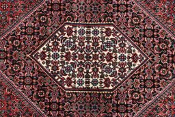 Backside of handmade New Bijar rug showing knot structure and weave density