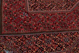 Backside of handmade New Bijar rug showing knot structure and weave density