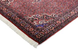 Backside of handmade New Bijar rug showing knot structure and weave density