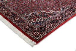 Backside of handmade New Bijar rug showing knot structure and weave density